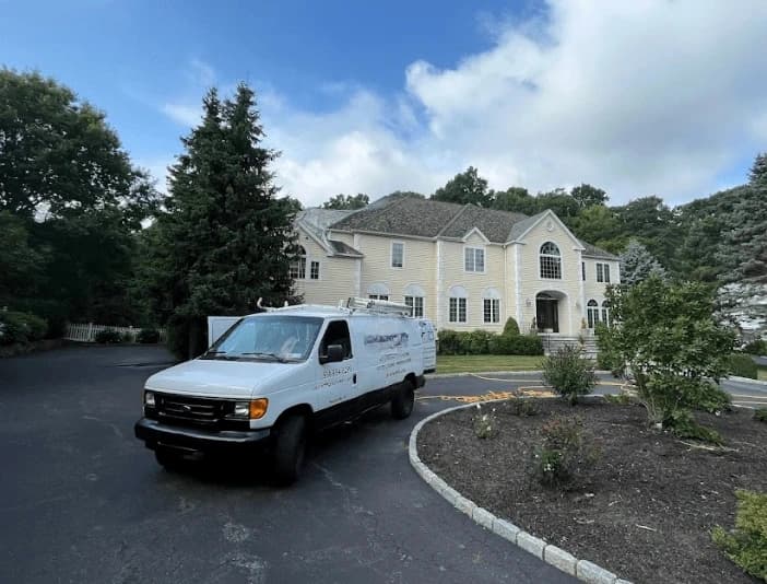 Streetsboro Power Washing technician performing thorough gutter cleaning service in Streetsboro